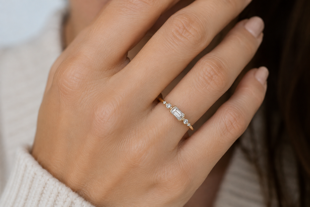 Aureline emerald-cut diamond ring worn on finger
