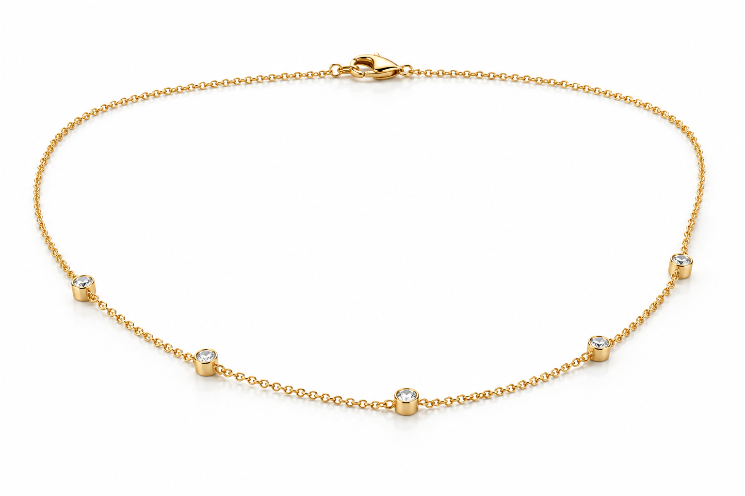 Side detail of Sélène bezel-set diamond station necklace in yellow gold