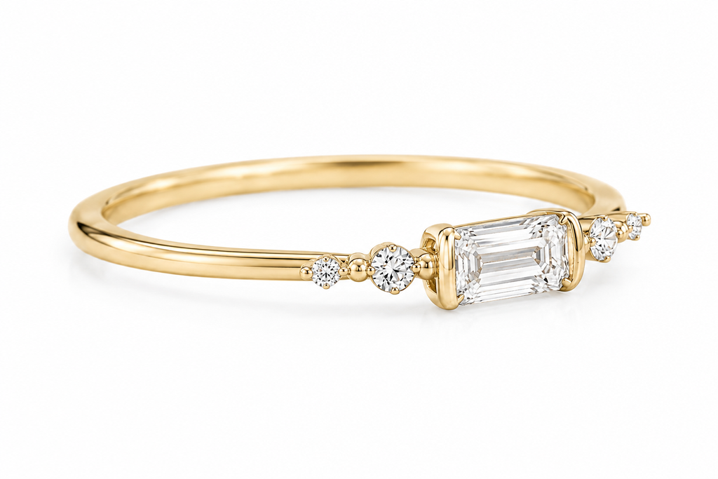 Side view of Aureline emerald-cut diamond ring setting in yellow gold
