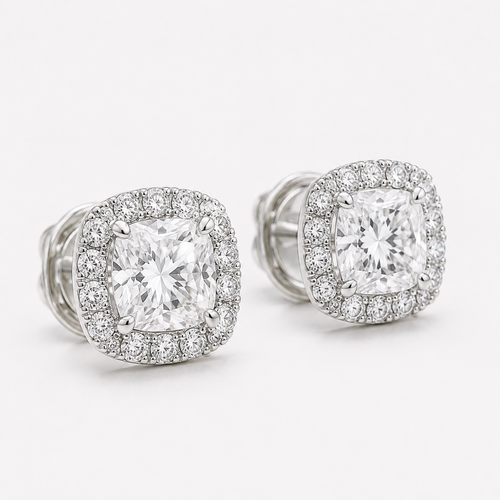 Close-up of cushion-cut natural diamond stud with round diamond halo in white gold
